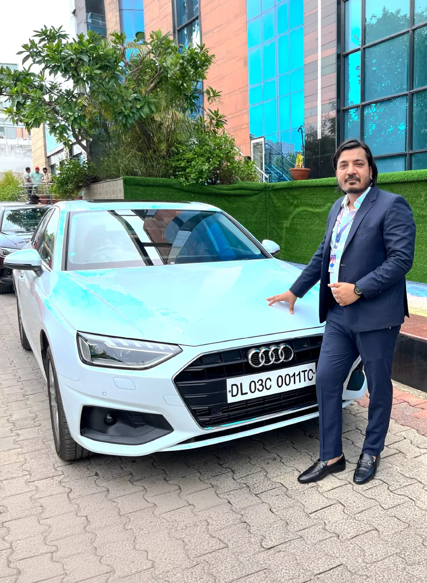 Employee with an Audi car award