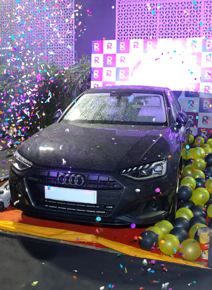 Employee with a new Audi car